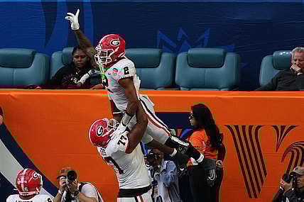 Dec 30, 2023; Miami Gardens, FL, USA; Georgia Bulldogs running back Kendall Milton (2) reacts after scoring a touchdown against the Florida State Seminoles during the first half in the 2023 Orange Bowl at Hard Rock Stadium. Mandatory Credit: Jasen Vinlove-USA TODAY Sports