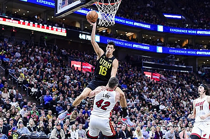 Dec 31, 2022; Salt Lake City, Utah, USA; Utah Jazz forward Simone Fontecchio (16) gets fouled by Miami Heat forward/center Kevin Love (42) during the second half at Vivint Arena. Mandatory Credit: Christopher Creveling-USA TODAY Sports