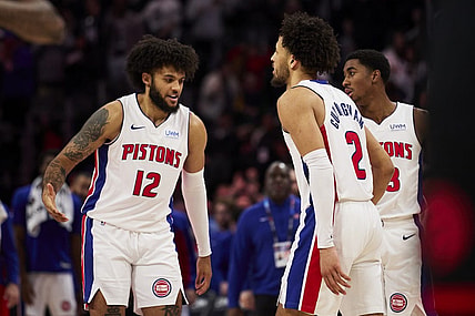 Dec 30, 2023; Detroit, Michigan, USA;  Detroit Pistons forward Isaiah Livers (12) and guard Cade Cunningham (2) celebrate after the game against the Toronto Raptors at Little Caesars Arena. Mandatory Credit: Rick Osentoski-USA TODAY Sports
