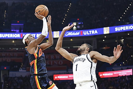 Dec 31, 2023; Oklahoma City, Oklahoma, USA; Oklahoma City Thunder guard Shai Gilgeous-Alexander (2) shoots as Brooklyn Nets forward Mikal Bridges (1) defends during the second quarter at Paycom Center. Mandatory Credit: Alonzo Adams-USA TODAY Sports
