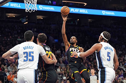 Dec 31, 2023; Phoenix, Arizona, USA; Phoenix Suns forward Kevin Durant (35) shoots against the Orlando Magic during the first half at Footprint Center. Mandatory Credit: Joe Camporeale-USA TODAY Sports