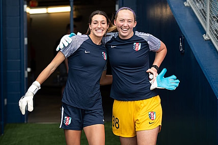 Aug 28, 2022; Kansas City, Kansas, USA; Kansas City Current goalkeeper Sydney Schneider (31) and Kansas City Current goalkeeper Cassie Miller (38) enter the pitch for warm ups before facing the North Carolina Courage at Children's Mercy Park. Mandatory Credit: Amy Kontras-USA TODAY Sports