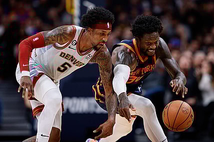 Nov 16, 2022; Denver, Colorado, USA; Denver Nuggets guard Kentavious Caldwell-Pope (5) and New York Knicks forward Julius Randle (30) battle for a loose ball in the fourth quarter at Ball Arena. Mandatory Credit: Isaiah J. Downing-USA TODAY Sports
