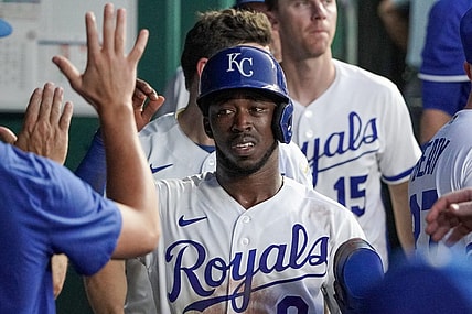 Aug 1, 2023; Kansas City, Missouri, USA; Kansas City Royals second baseman Samad Taylor (0) is congratulated in the dugout against the New York Mets after scoring in the fifth inning at Kauffman Stadium. Mandatory Credit: Denny Medley-USA TODAY Sports