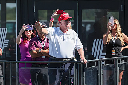 Aug 13, 2023; Bedminster, New Jersey, USA; Former President Donald Trump waves to the fans during the final round of the LIV Golf Bedminster golf tournament at Trump National Bedminster. Mandatory Credit: Vincent Carchietta-USA TODAY Sports