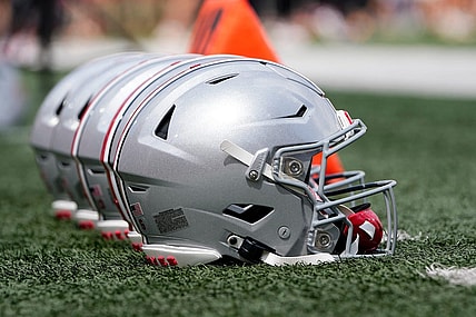Sep 2, 2023; Bloomington, Indiana, USA; Ohio State Buckeyes helmets sit on the sideline prior to the NCAA football game at Indiana University Memorial Stadium. Ohio State won 23-3.