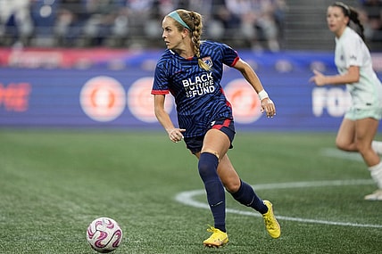 Sep 6, 2023; Seattle, WA, USA; OL Reign midfielder Nikki Stanton (7) kicks the ball against Racing Louisville FC during the first half at Lumen Field. Mandatory Credit: Stephen Brashear-USA TODAY Sports