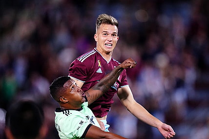 Sep 30, 2023; Commerce City, Colorado, USA; Austin FC midfielder Jhojan Valencia (5) and Colorado Rapids midfielder Cole Bassett (23) during the second half at Dick's Sporting Goods Park. Mandatory Credit: Ron Chenoy-USA TODAY Sports