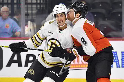 Oct 2, 2023; Philadelphia, Pennsylvania, USA; Boston Bruins center Marc McLaughlin (26) and Philadelphia Flyers defenseman Cam York (8) battle for position during the third period at Wells Fargo Center. Mandatory Credit: Eric Hartline-USA TODAY Sports