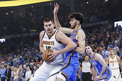 Oct 29, 2023; Oklahoma City, Oklahoma, USA; Denver Nuggets center Nikola Jokic (15) drives to the basket against Oklahoma City Thunder forward Chet Holmgren (7) during the first quarter at Paycom Center. Mandatory Credit: Alonzo Adams-USA TODAY Sports