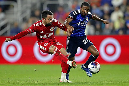 Oct 29, 2023; Cincinnati, OH, USA; New York Red Bulls midfielder Luquinhas (82) battles for the ball against FC Cincinnati defender Ray Gaddis (28) during the first half of game one in a round one match of the 2023 MLS Cup Playoffs at TQL Stadium. Mandatory Credit: Katie Stratman-USA TODAY Sports