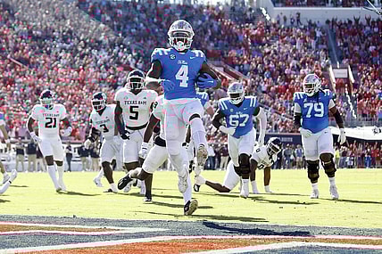 Nov 4, 2023; Oxford, Mississippi, USA; Mississippi Rebels running back Quinshon Judkins (4) runs the ball for a touchdown during the first half against the Texas A&M Aggies at Vaught-Hemingway Stadium. Mandatory Credit: Petre Thomas-USA TODAY Sports