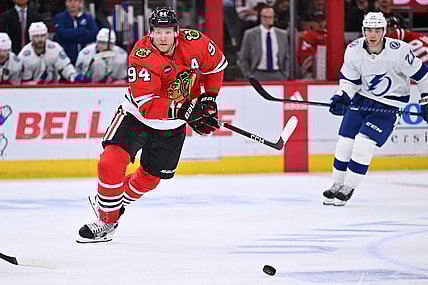 Nov 16, 2023; Chicago, Illinois, USA; Chicago Blackhawks forward Corey Perry (94) chases after a loose puck in the third period against the Tampa Bay Lightning at United Center. Mandatory Credit: Jamie Sabau-USA TODAY Sports