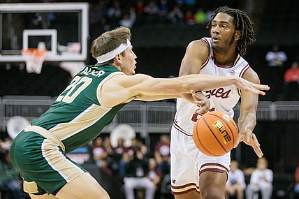 Nov 22, 2023; Kansas City, Missouri, USA; Boston College Eagles forward Devin McGlockton (21) passes the ball around Colorado State Rams guard Joe Palmer (20) during the first half at T-Mobile Center. Mandatory Credit: William Purnell-USA TODAY Sports