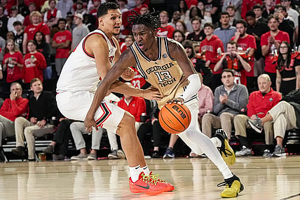 Dec 5, 2023; Athens, Georgia, USA; Georgia Tech Yellow Jackets guard Miles Kelly (13) dribbles against Georgia Bulldogs guard RJ Melendez (15) during the second half at Stegeman Coliseum. Mandatory Credit: Dale Zanine-USA TODAY Sports