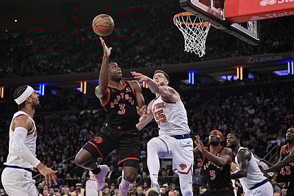 Dec 11, 2023; New York, New York, USA; Toronto Raptors forward O.G. Anunoby (3) shoots the ball while being defended by New York Knicks center Isaiah Hartenstein (55) during the fourth quarter at Madison Square Garden. Mandatory Credit: John Jones-USA TODAY Sports