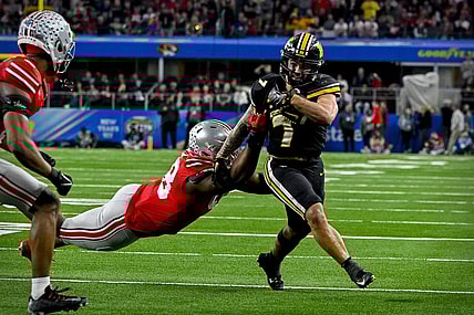 Dec 29, 2023; Arlington, TX, USA; Missouri Tigers running back Cody Schrader (7) runs for a first down against the Ohio State Buckeyes during the fourth quarter at AT&T Stadium. Mandatory Credit: Jerome Miron-USA TODAY Sports