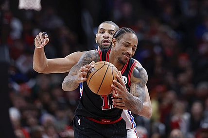 Dec 30, 2023; Chicago, Illinois, USA; Philadelphia 76ers forward Nicolas Batum (40) defends against Chicago Bulls forward DeMar DeRozan (11) during the second half at United Center. Mandatory Credit: Kamil Krzaczynski-USA TODAY Sports
