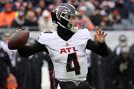 Dec 31, 2023; Chicago, Illinois, USA; Atlanta Falcons quarterback Taylor Heinicke (4) drops back to pass against the Chicago Bears during the first half at Soldier Field. Mandatory Credit: Mike Dinovo-USA TODAY Sports