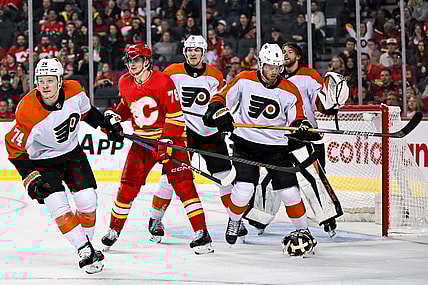 Dec 31, 2023; Calgary, Alberta, CAN; Philadelphia Flyers goaltender Samuel Ersson (33) pulls off his mask during the third period in a game against the Calgary Flames at Scotiabank Saddledome. Mandatory Credit: Brett Holmes-USA TODAY Sports