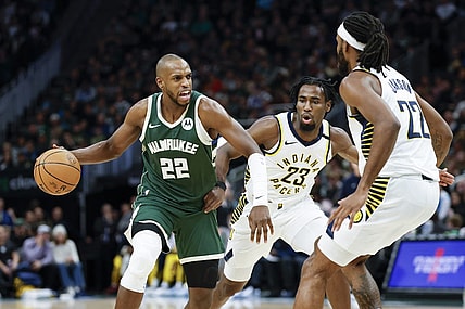 Jan 1, 2024; Milwaukee, Wisconsin, USA; Milwaukee Bucks forward Khris Middleton (22) drives to the basket against Indiana Pacers forward Isaiah Jackson (22) during the first half at Fiserv Forum. Mandatory Credit: Kamil Krzaczynski-USA TODAY Sports
