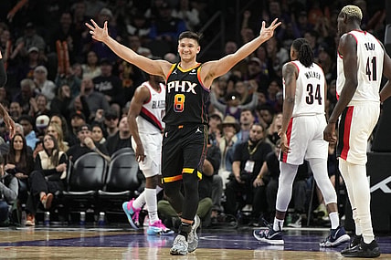 Jan 1, 2024; Phoenix, Arizona, USA; Phoenix Suns guard Grayson Allen (8) reacts after guard Devin Booker (1) makes a basket against the Portland Trail Blazers in the second half at Footprint Center. Mandatory Credit: Rick Scuteri-USA TODAY Sports