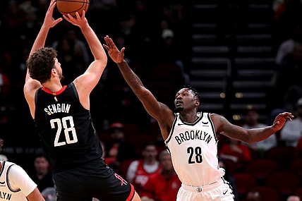 Jan 3, 2024; Houston, Texas, USA; Houston Rockets center Alperen Sengun (28) shoots against Brooklyn Nets forward Dorian Finney-Smith (28) during the first quarter at Toyota Center. Mandatory Credit: Erik Williams-USA TODAY Sports