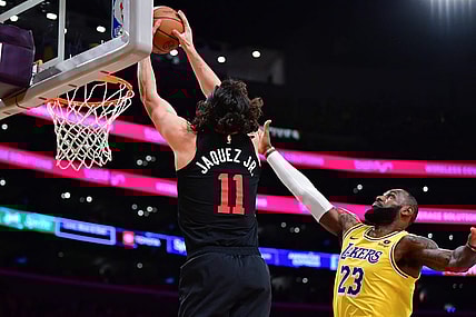 Jan 3, 2024; Los Angeles, California, USA; Miami Heat guard Jaime Jaquez Jr. (11) moves to the basket against Los Angeles Lakers forward LeBron James (23) during the first half at Crypto.com Arena. Mandatory Credit: Gary A. Vasquez-USA TODAY Sports