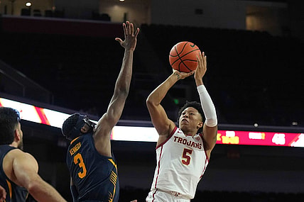 Jan 3, 2024; Los Angeles, California, USA; Southern California Trojans guard Boogie Ellis (5) shoots the ball against California Golden Bears guard Keonte Kennedy (3) in the second half at Galen Center. Mandatory Credit: Kirby Lee-USA TODAY Sports