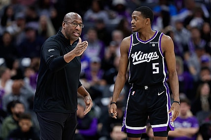 Jan 3, 2024; Sacramento, California, USA; Sacramento Kings head coach Mike Brown talks with guard De'Aaron Fox (5) during the third quarter against the Orlando Magic at Golden 1 Center. Mandatory Credit: Sergio Estrada-USA TODAY Sports