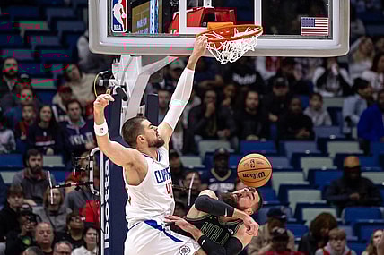 Jan 5, 2024; New Orleans, Louisiana, USA;  LA Clippers center Ivica Zubac (40) dunks the ball against New Orleans Pelicans center Jonas Valanciunas (17) during the first half at Smoothie King Center. Mandatory Credit: Stephen Lew-USA TODAY Sports