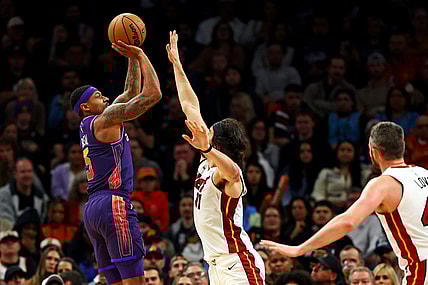 Jan 5, 2024; Phoenix, Arizona, USA; Phoenix Suns guard Bradley Beal (3) shoots the ball against Miami Heat guard Jaime Jaquez Jr. (11) during the fourth quarter at Footprint Center. Mandatory Credit: Mark J. Rebilas-USA TODAY Sports