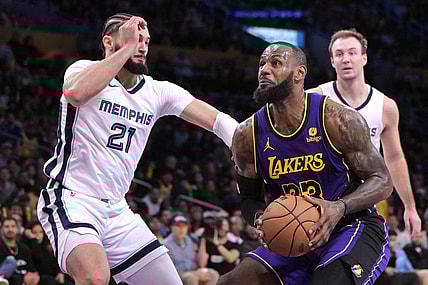 Jan 5, 2024; Los Angeles, California, USA; Los Angeles Lakers forward LeBron James (23) drives to the basket past Memphis Grizzlies forward David Roddy (21) in the first half at Crypto.com Arena. Mandatory Credit: Jayne Kamin-Oncea-USA TODAY Sports