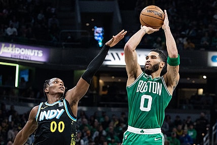 Jan 6, 2024; Indianapolis, Indiana, USA; Boston Celtics forward Jayson Tatum (0) shoots the ball against Indiana Pacers guard Bennedict Mathurin (00) in the first half at Gainbridge Fieldhouse. Mandatory Credit: Trevor Ruszkowski-USA TODAY Sports