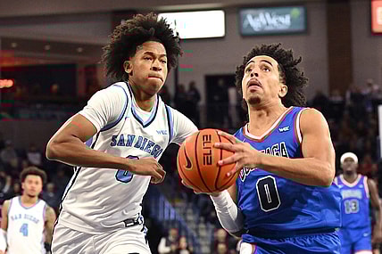 Jan 6, 2024; Spokane, Washington, USA; Gonzaga Bulldogs guard Ryan Nembhard (0) shoots the ball against San Diego Toreros guard Kevin Patton Jr. (0) in the second half at McCarthey Athletic Center. Gonzaga won 101-74. Mandatory Credit: James Snook-USA TODAY Sports
