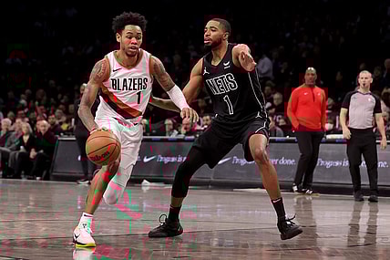 Jan 7, 2024; Brooklyn, New York, USA; Portland Trail Blazers guard Anfernee Simons (1) drives to the basket against Brooklyn Nets forward Mikal Bridges (1) during the first quarter at Barclays Center. Mandatory Credit: Brad Penner-USA TODAY Sports