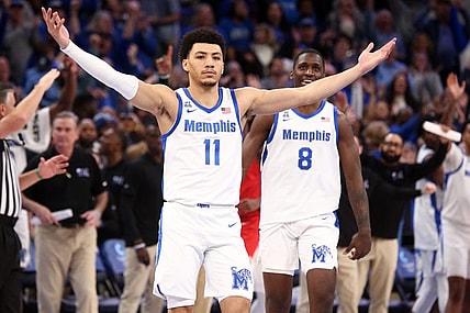 Jan 7, 2024; Memphis, Tennessee, USA; Memphis Tigers guard Jahvon Quinerly (11) reacts after making a three point shot with 3.2 seconds left during the second half against the Southern Methodist Mustangs at FedExForum. Mandatory Credit: Petre Thomas-USA TODAY Sports