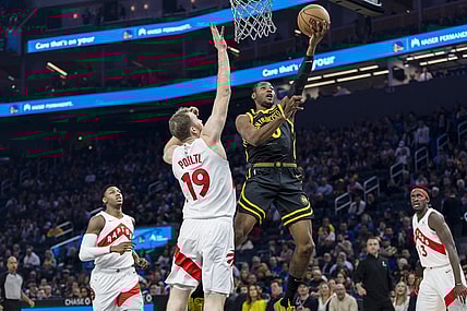 Jan 7, 2024; San Francisco, California, USA;  Toronto Raptors center Jakob Poeltl (19) defends against a shot by Golden State Warriors forward Jonathan Kuminga (00)  during the first half at Chase Center. Mandatory Credit: John Hefti-USA TODAY Sports