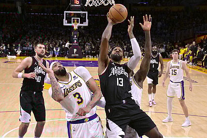 Jan 7, 2024; Los Angeles, California, USA;  Los Angeles Clippers forward Paul George (13) shoots over Los Angeles Lakers forward Anthony Davis (3) in the second half at Crypto.com Arena. Mandatory Credit: Jayne Kamin-Oncea-USA TODAY Sports