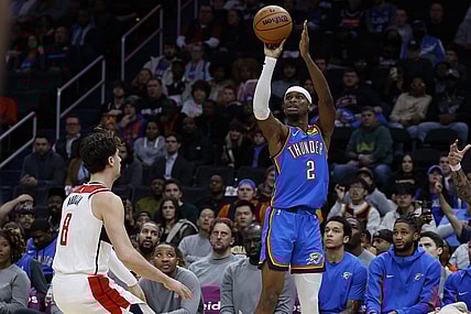 Jan 8, 2024; Washington, District of Columbia, USA; Oklahoma City Thunder guard Shai Gilgeous-Alexander (2) shoots the ball over Washington Wizards forward Deni Avdija (8) in the first quarter at Capital One Arena. Mandatory Credit: Geoff Burke-USA TODAY Sports