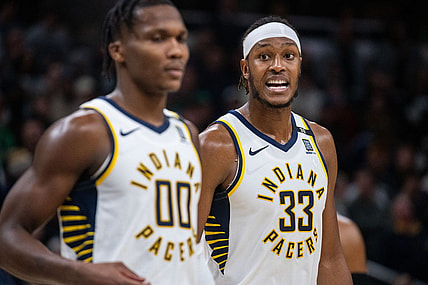 Jan 8, 2024; Indianapolis, Indiana, USA; Indiana Pacers center Myles Turner (33) talks to guard Bennedict Mathurin (00) after a timeout  in the second half against the Boston Celtics at Gainbridge Fieldhouse. Mandatory Credit: Trevor Ruszkowski-USA TODAY Sports