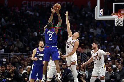 Jan 8, 2024; Los Angeles, California, USA;  Los Angeles Clippers forward Kawhi Leonard (2) shoots the ball over Phoenix Suns guard Grayson Allen (8) during the second half at Crypto.com Arena. Mandatory Credit: Kiyoshi Mio-USA TODAY Sports