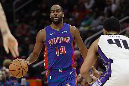 Jan 9, 2024; Detroit, Michigan, USA;  Detroit Pistons guard Alec Burks (14) dribbles defended by Sacramento Kings forward Trey Lyles (41) in the second half at Little Caesars Arena. Mandatory Credit: Rick Osentoski-USA TODAY Sports