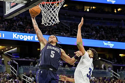 Jan 9, 2024; Orlando, Florida, USA; Orlando Magic forward Paolo Banchero (5) dunks against Minnesota Timberwolves center Karl-Anthony Towns (32) during the second half at KIA Center. Mandatory Credit: Mike Watters-USA TODAY Sports