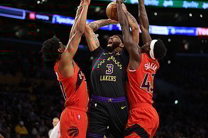 Jan 9, 2024; Los Angeles, California, USA; Los Angeles Lakers forward Anthony Davis (3) shoots the ball between Toronto Raptors forward Thaddeus Young (21) and forward Pascal Siakam (43) during the first quarter at Crypto.com Arena. Mandatory Credit: Kiyoshi Mio-USA TODAY Sports
