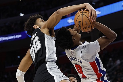 Jan 10, 2024; Detroit, Michigan, USA;  San Antonio Spurs forward Dominick Barlow (26) blocks a shot by Detroit Pistons forward Ausar Thompson (9) in the first half at Little Caesars Arena. Mandatory Credit: Rick Osentoski-USA TODAY Sports