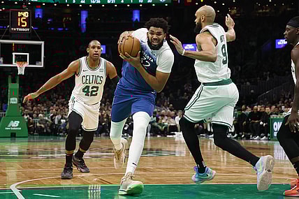 Jan 10, 2024; Boston, Massachusetts, USA; Minnesota Timberwolves center Karl-Anthony Towns (32) drives on Boston Celtics guard Derrick White (9) during the second quarter at TD Garden. Mandatory Credit: Winslow Townson-USA TODAY Sports