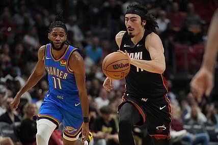 Jan 10, 2024; Miami, Florida, USA; Miami Heat guard Jaime Jaquez Jr. (11) brings the ball up the court against the Oklahoma City Thunder during the first half at Kaseya Center. Mandatory Credit: Jim Rassol-USA TODAY Sports