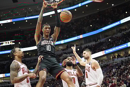 Jan 10, 2024; Chicago, Illinois, USA; Houston Rockets forward Jabari Smith Jr. (10) dunks the ball on Chicago Bulls forward DeMar DeRozan (11) during the first quarter at United Center. Mandatory Credit: David Banks-USA TODAY Sports