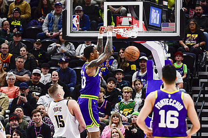 Jan 10, 2024; Salt Lake City, Utah, USA; Utah Jazz forward/center John Collins (20) dunks over Denver Nuggets center Nikola Jokic (15) during the first half at the Delta Center. Mandatory Credit: Christopher Creveling-USA TODAY Sports